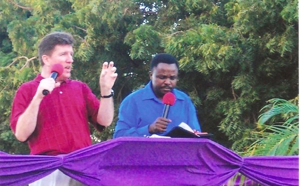 Preaching open air meeting with Pastor George Makala interpreting in Tanzania