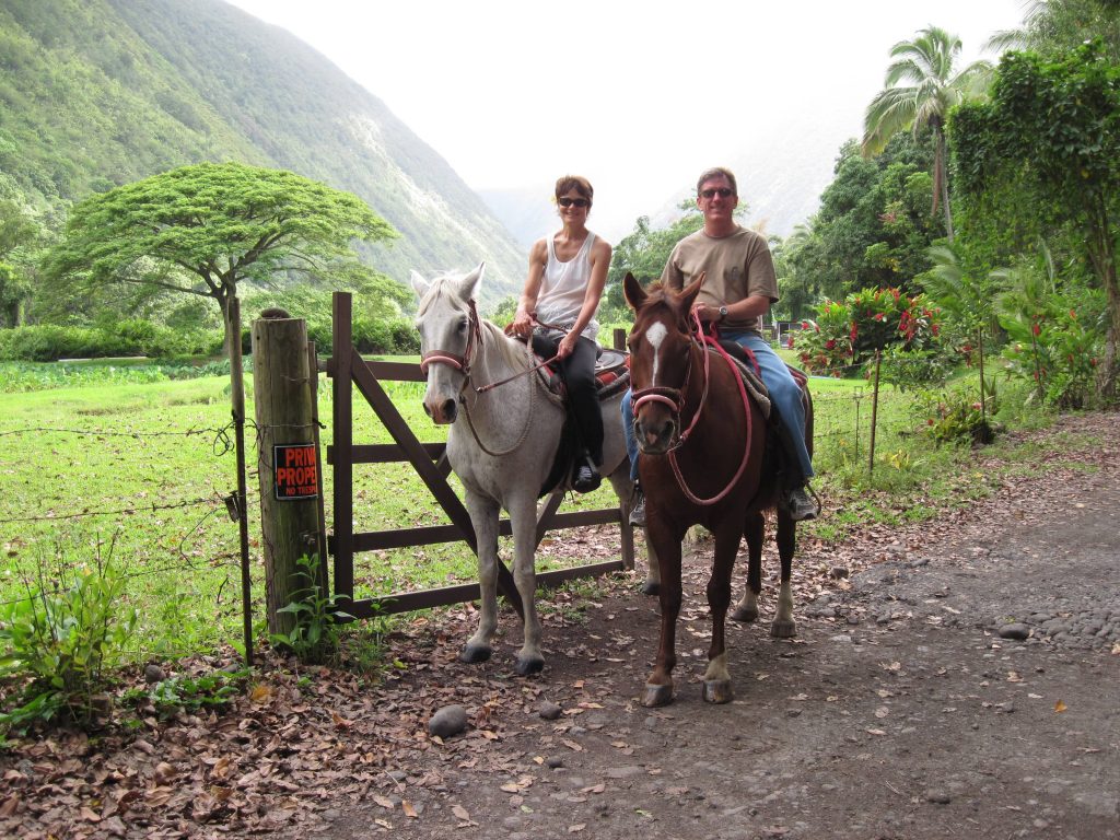 Roanne and Jerry horseback riding in Hawaii